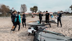 Maciek with participants on the beach