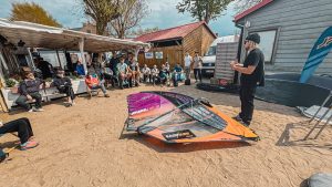 Maciek explaining how to trim a windsurfing sail