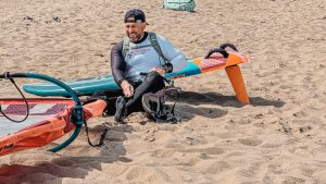 windsurfer down hauling a sail