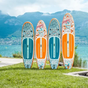 Aqua Marina Pure Air Coast SUP boards standing on grass