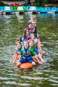 Kids playing on a big sup board