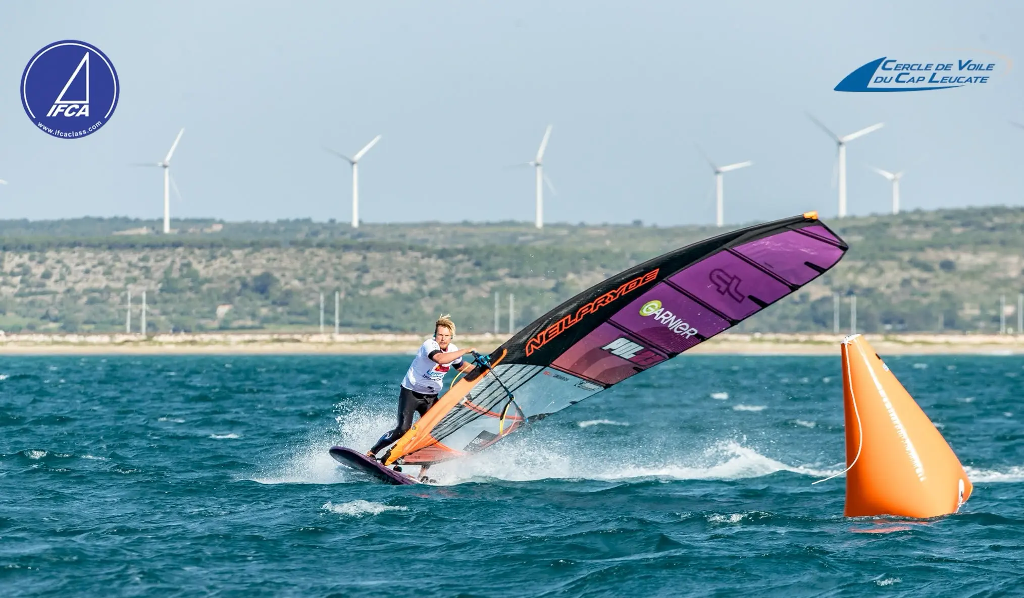 Maciek Rutkowski POL23 at the buoy, EASY-surfshop logo visible, IFCA 2026 Leucate