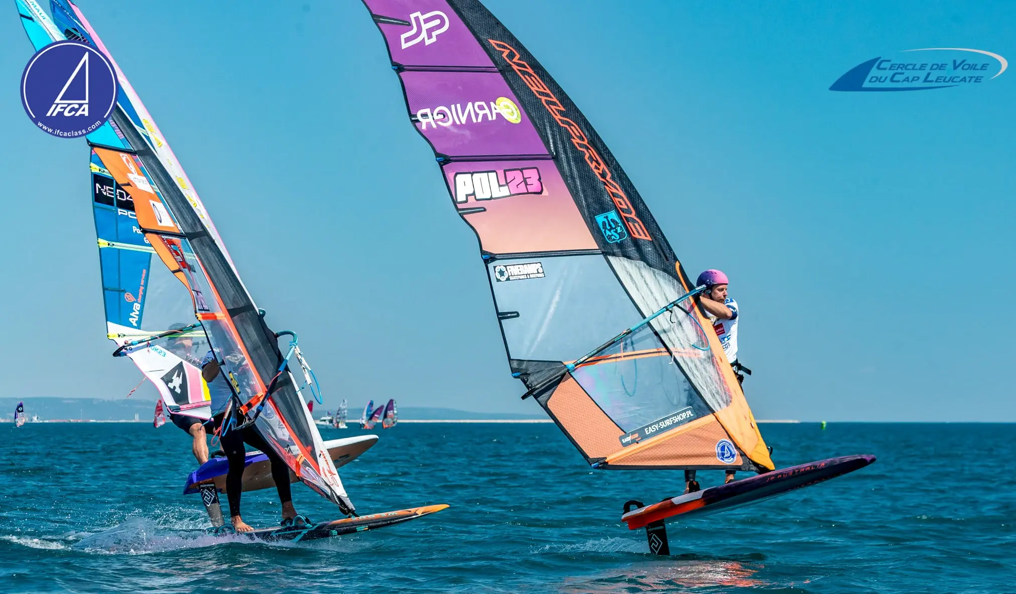 Maciek Rutkowski POL23 on JP-Australia board, NeilPryde sail, EASY-SURFSHOP.PL visible, IFCA 2026 Leucate